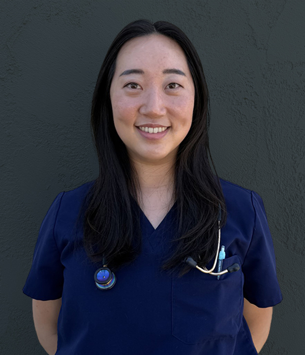 An asian women in blue scrubs with a stethescope.
